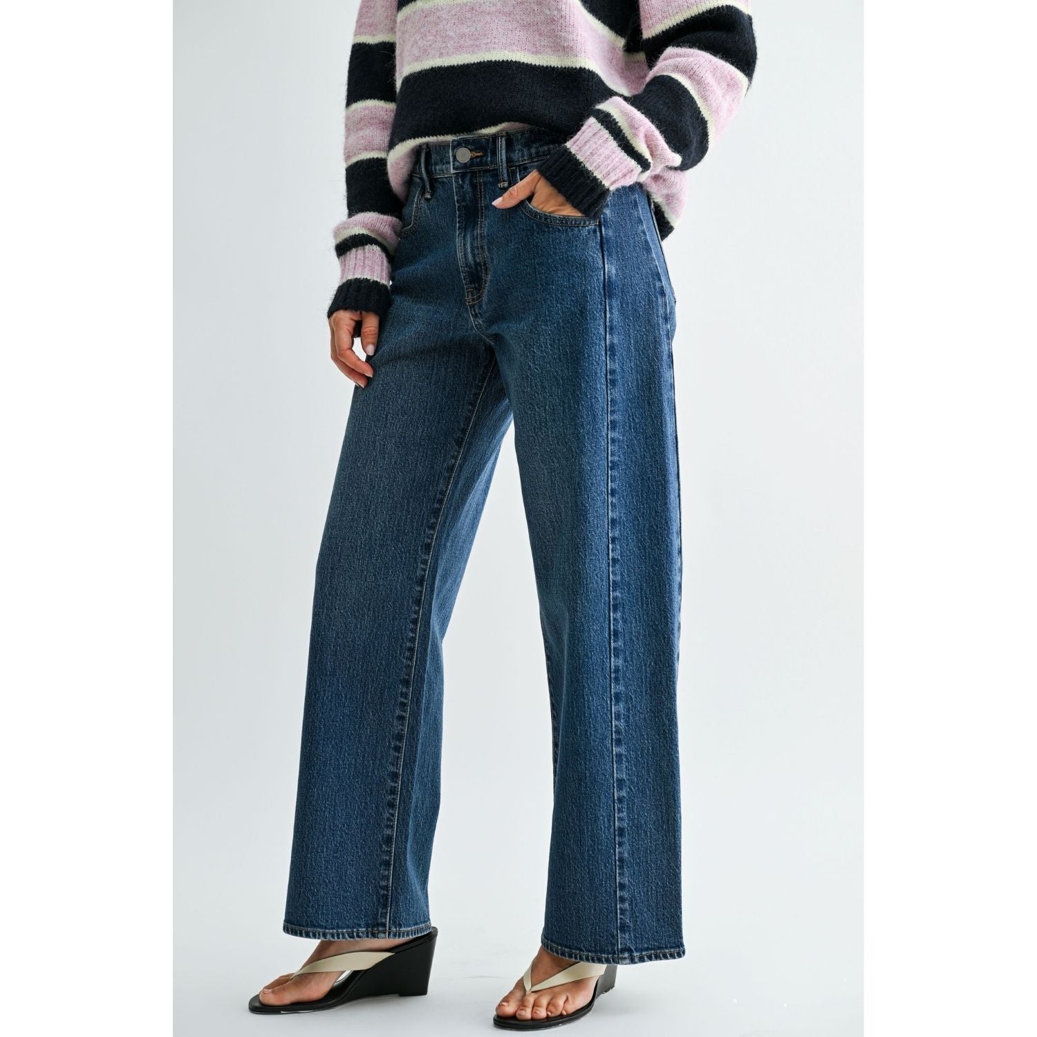 Vintage brown high-rise wide-leg jeans with a curved silhouette and gently tapered ankle.