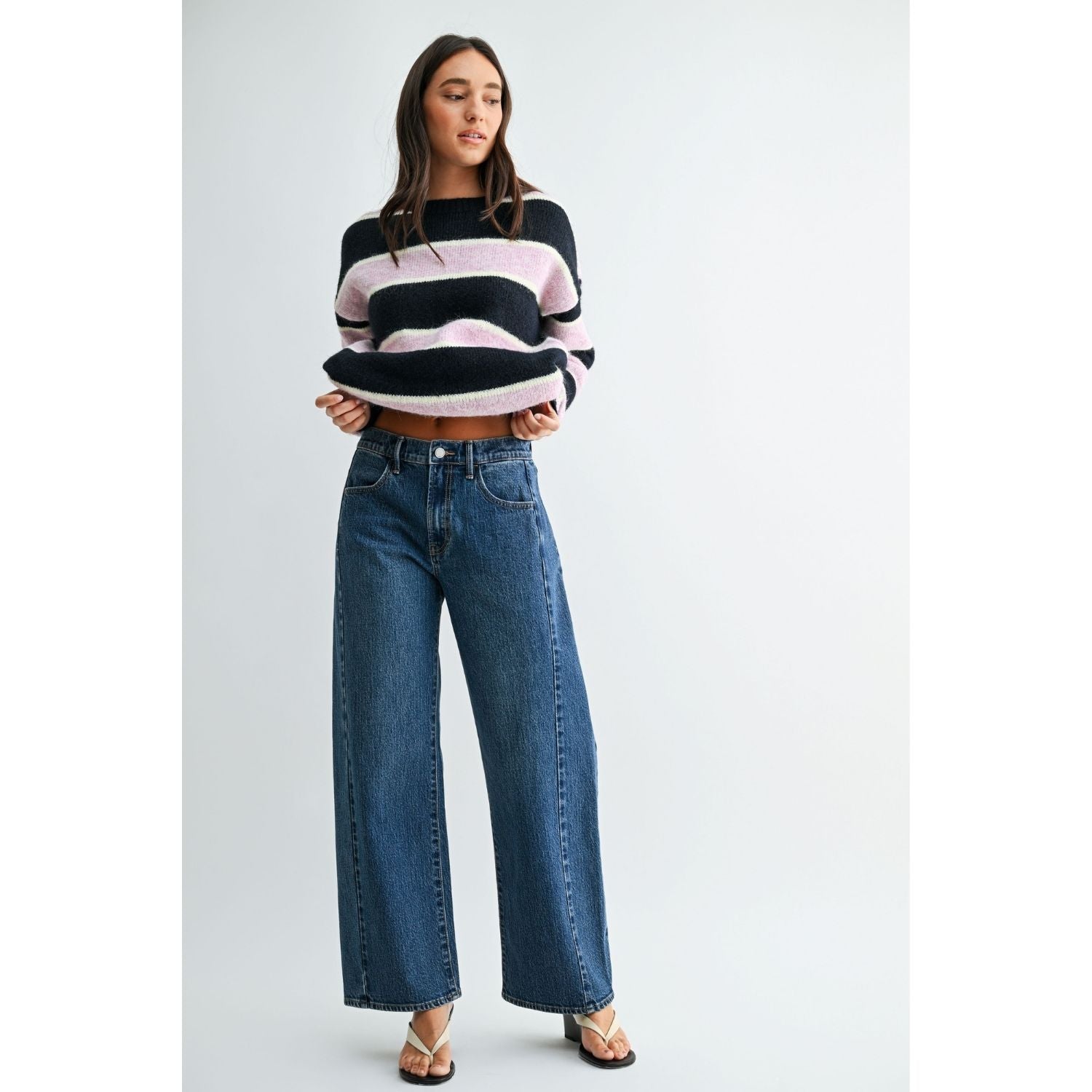 Vintage brown high-rise wide-leg jeans with a curved silhouette and gently tapered ankle.