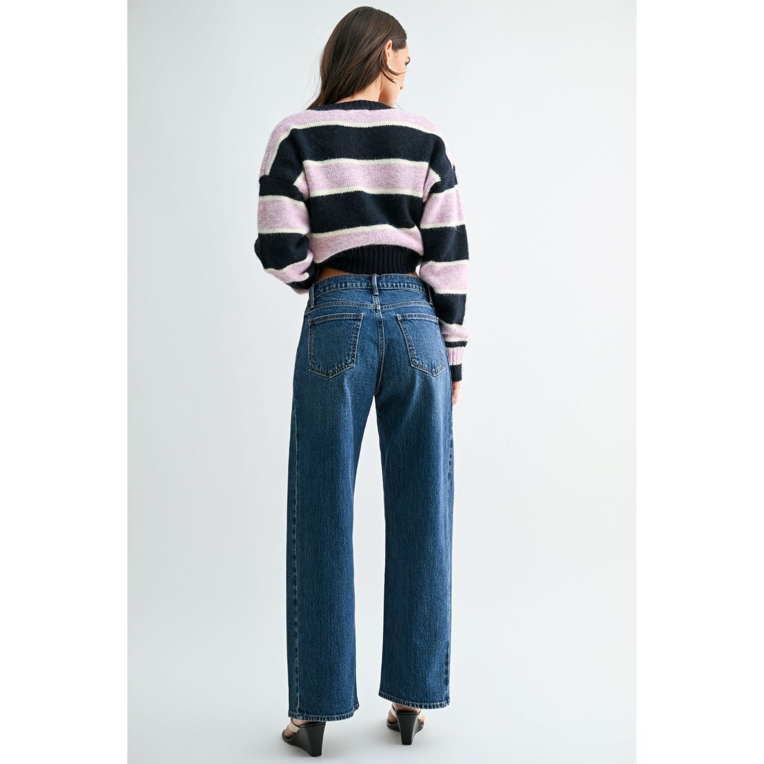Vintage brown high-rise wide-leg jeans with a curved silhouette and gently tapered ankle.
