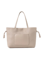 Oversized woven tote bag with textured intrecciato-inspired detailing, shoulder straps, front pocket, and adjustable drawstring side accents.