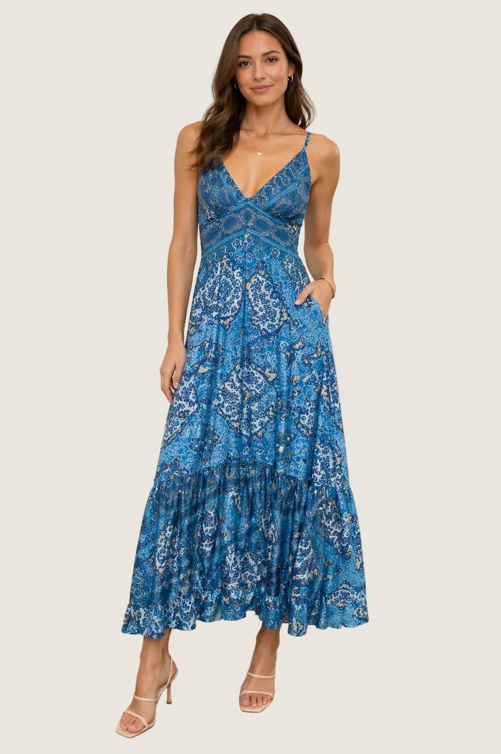 Printed tiered maxi dress with thin straps and fitted bodice on model