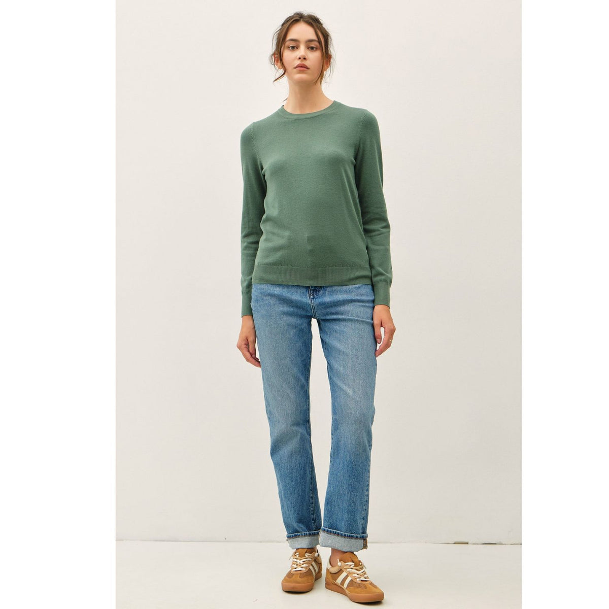 Women's sage crew neck knit sweater with long sleeves, ribbed hem and cuffs, and a relaxed fit