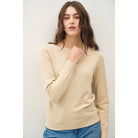 Women's sage crew neck knit sweater with long sleeves, ribbed hem and cuffs, and a relaxed fit