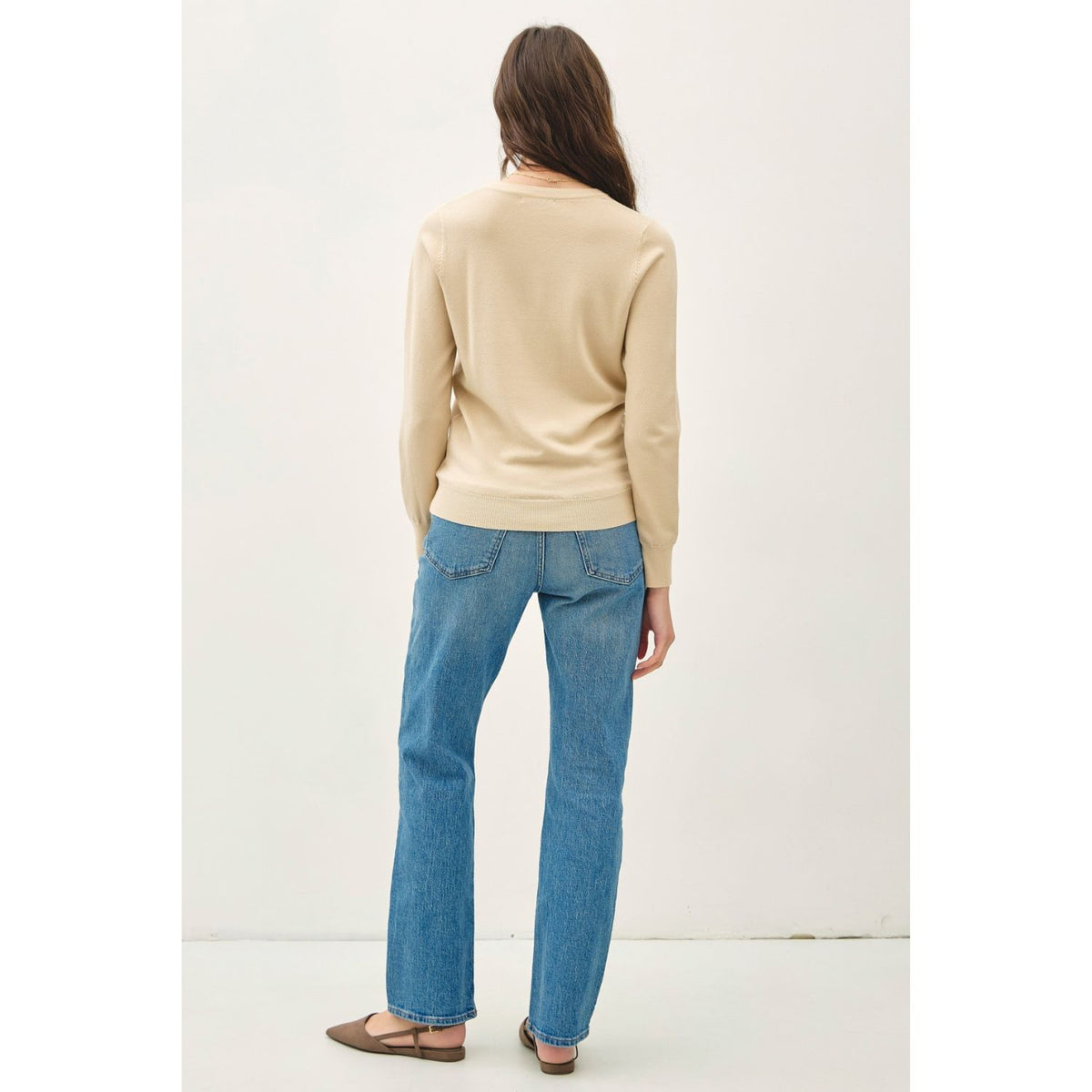 Women's sage crew neck knit sweater with long sleeves, ribbed hem and cuffs, and a relaxed fit