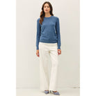 Women's sage crew neck knit sweater with long sleeves, ribbed hem and cuffs, and a relaxed fit
