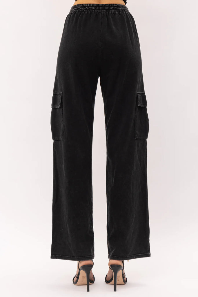 Remi Utility Pant Black. These utility pants feature an elastic waist band with cargo style pocks and a straight leg fit, wear them on their own or as a set with the Remi Bustier Top.