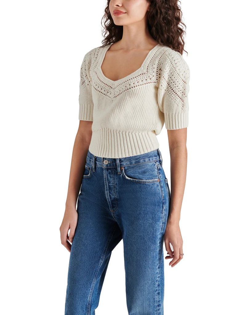 Steve Madden Darcia Sweater Ivory. This knit sweater features a quarter sleeve with a sweetheart neckline and crochet detailing along the collar and sleeves, such a pretty top to add to your closet.