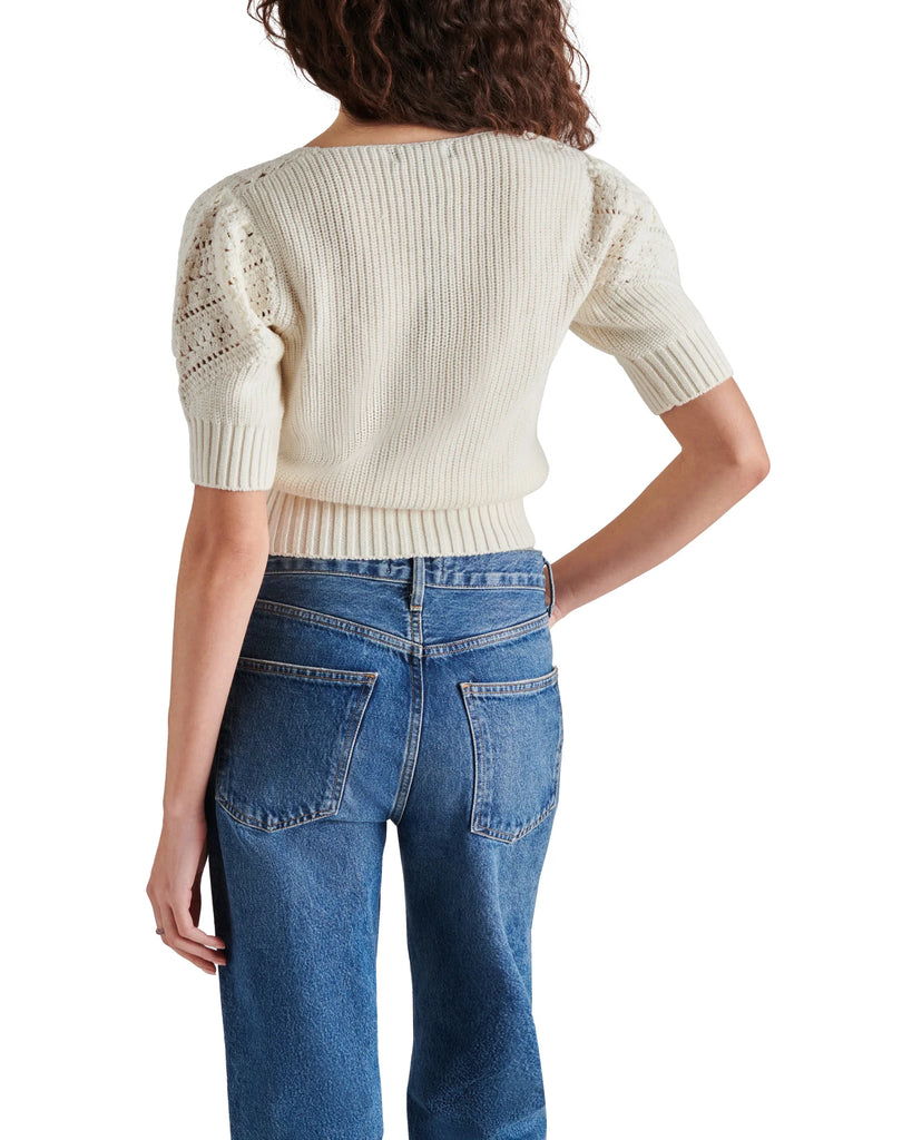 Steve Madden Darcia Sweater Ivory. This knit sweater features a quarter sleeve with a sweetheart neckline and crochet detailing along the collar and sleeves, such a pretty top to add to your closet.