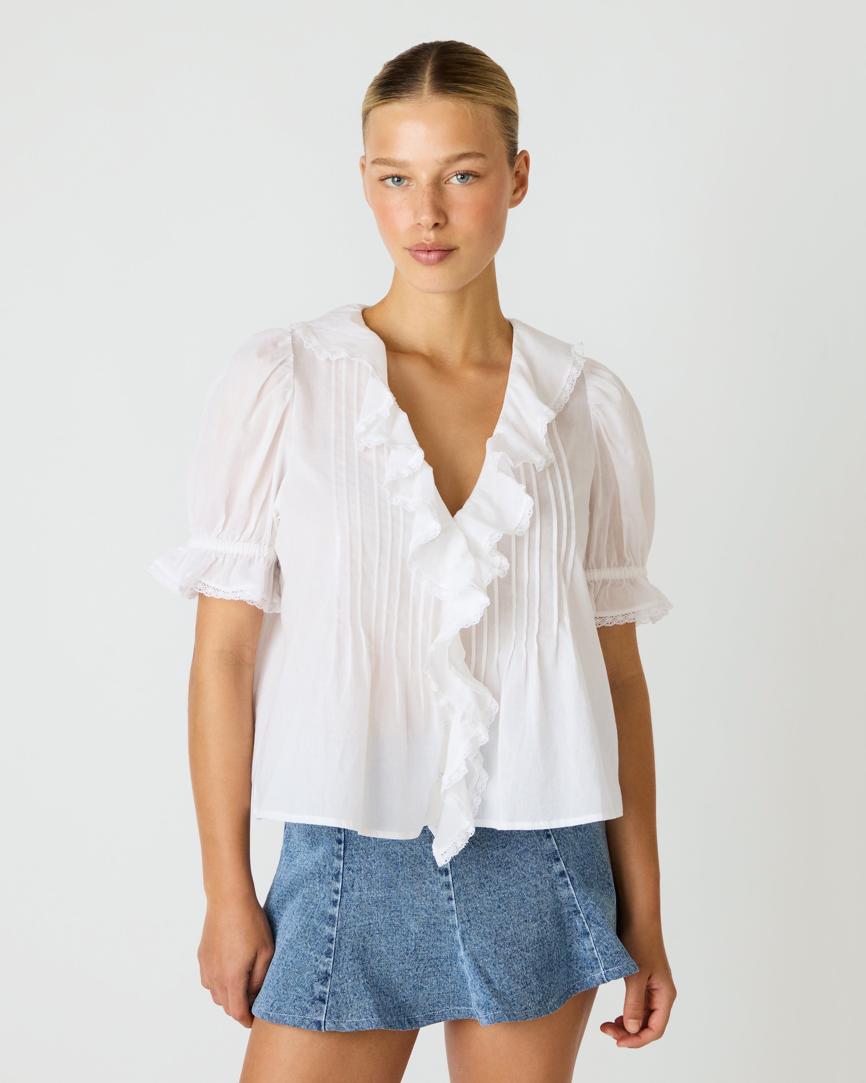 ruffle blouse, feminine blouse, romantic top, pintuck detail blouse, puff sleeve blouse, lightweight blouse, dressy casual top, boutique blouse, everyday elevated top, chic ruffle shirt, spring blouse, summer blouse, date night top, versatile blouse, effortless style top, trendy boutique clothing, womens fashion top, modern feminine blouse