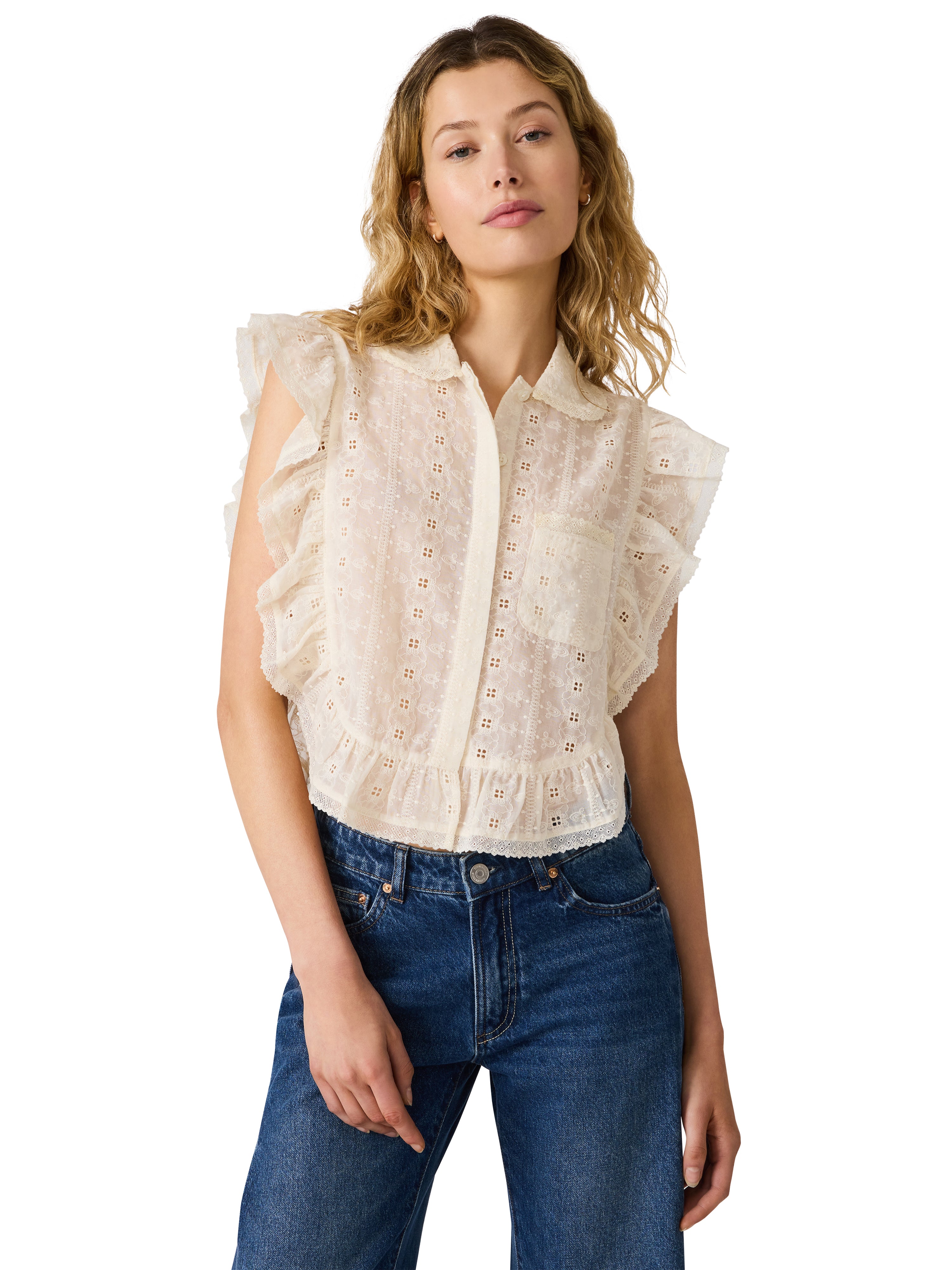 Eyelet blouse with ruffle sleeves, button-front detail, and cropped silhouette styled with jeans