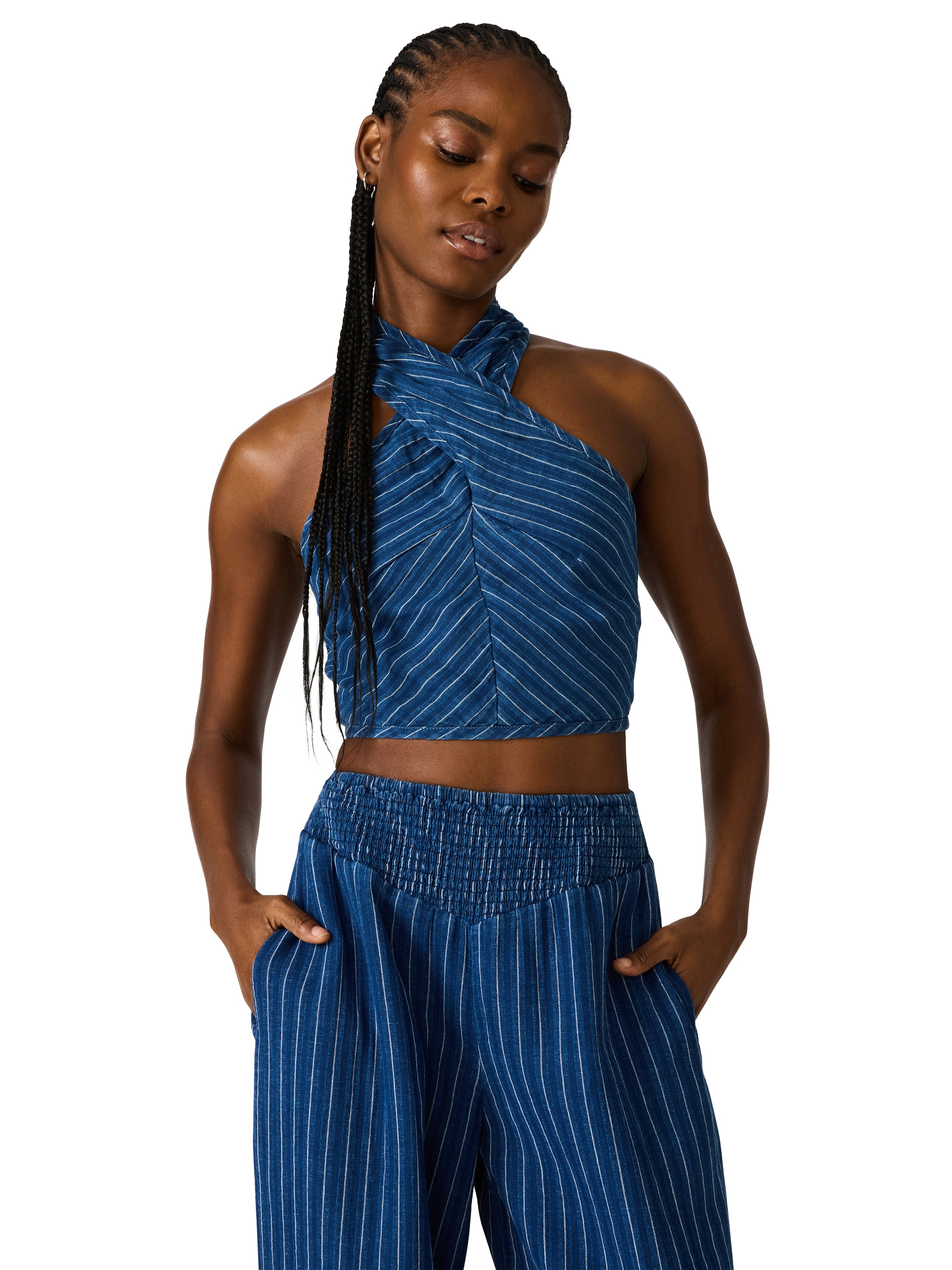 Two-piece set with cropped cross-front halter top and smocked waistband bottom in a relaxed fit
