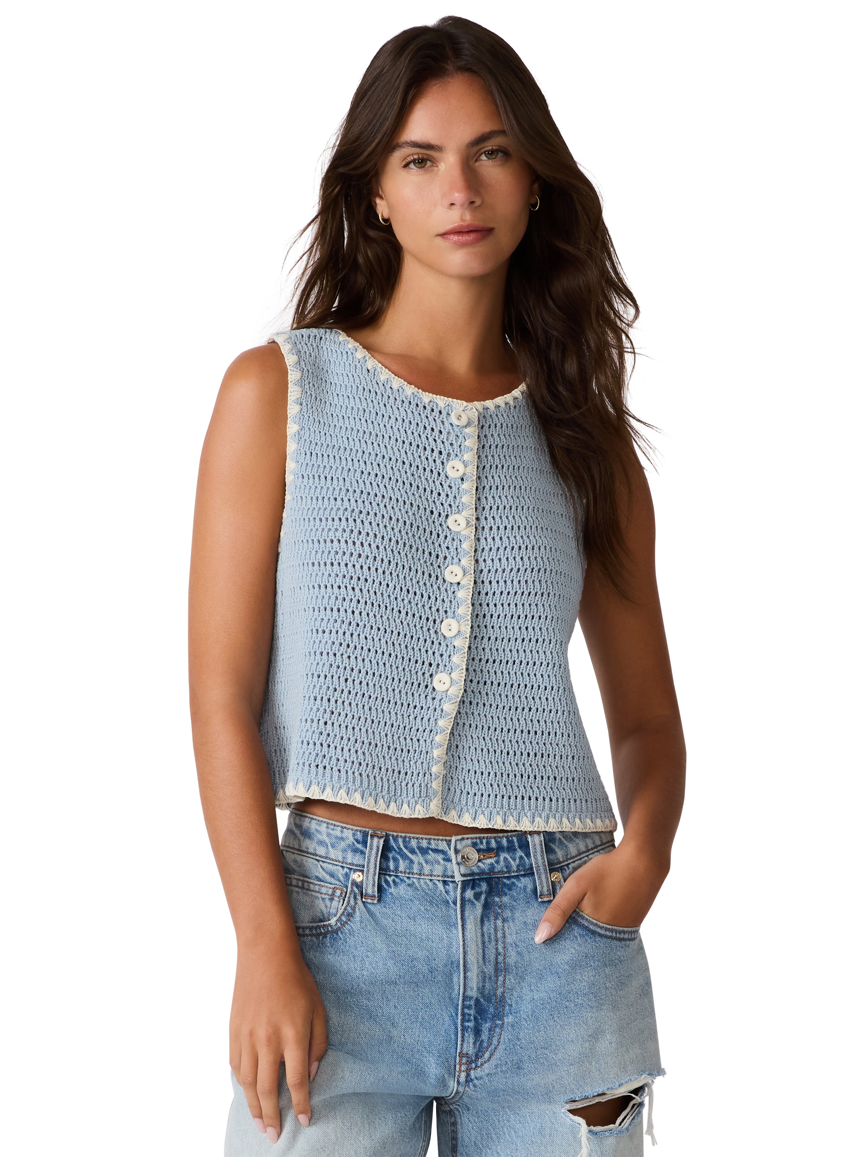 Sleeveless knit top with button front, textured fabric, and trim detail paired with denim