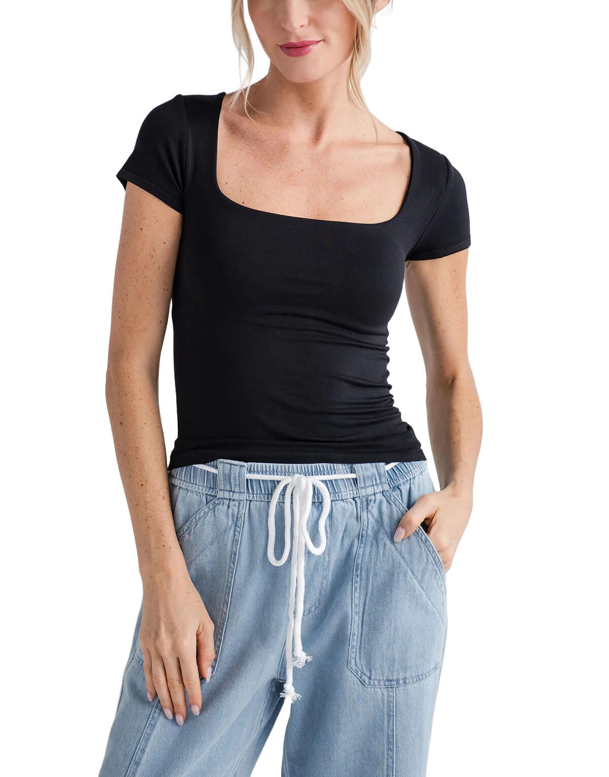 Free People Clean Lines Baby Tree Black. A new addition to your favorite seamless collection, this ultra-soft tee is featured in a slim-fitting silhouette with a square neckline and cap-inspired sleeves.