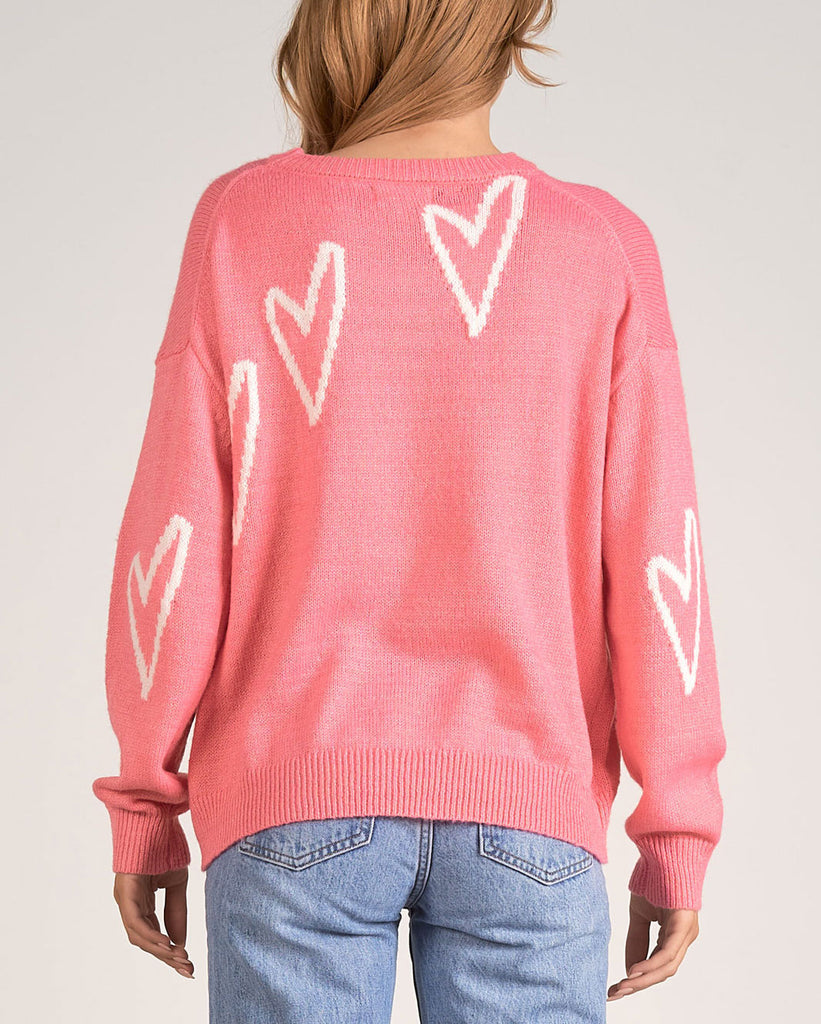 Elan Heart Crewneck Sweater Rose Pink. This adorable heart crewneck sweater is the perfect piece to add to your closet, just in time for Valentines Day!