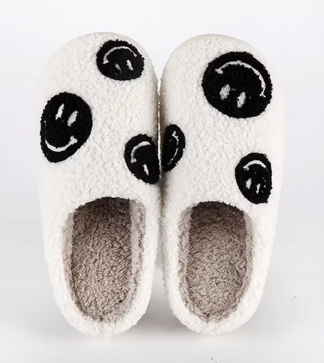 Stay cozy, stylish, and happy with these Multi Black Smiley Face Slippers from Whim! Perfect for weekends with the fam or working from home.