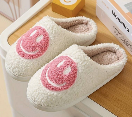 Smiley Face Slippers Pink. Stay cozy, stylish, and happy with Smiley Face Slippers from Whim! Perfect for weekends with the fam or working from home.