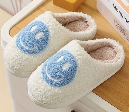 Smiley Face Slippers Blue. Stay cozy, stylish, and happy with Smiley Face Slippers from Whim! Perfect for weekends with the fam or working from home.