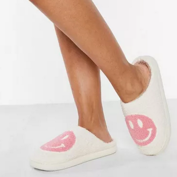 Smiley Face Slippers Pink. Stay cozy, stylish, and happy with Smiley Face Slippers from Whim! Perfect for weekends with the fam or working from home.