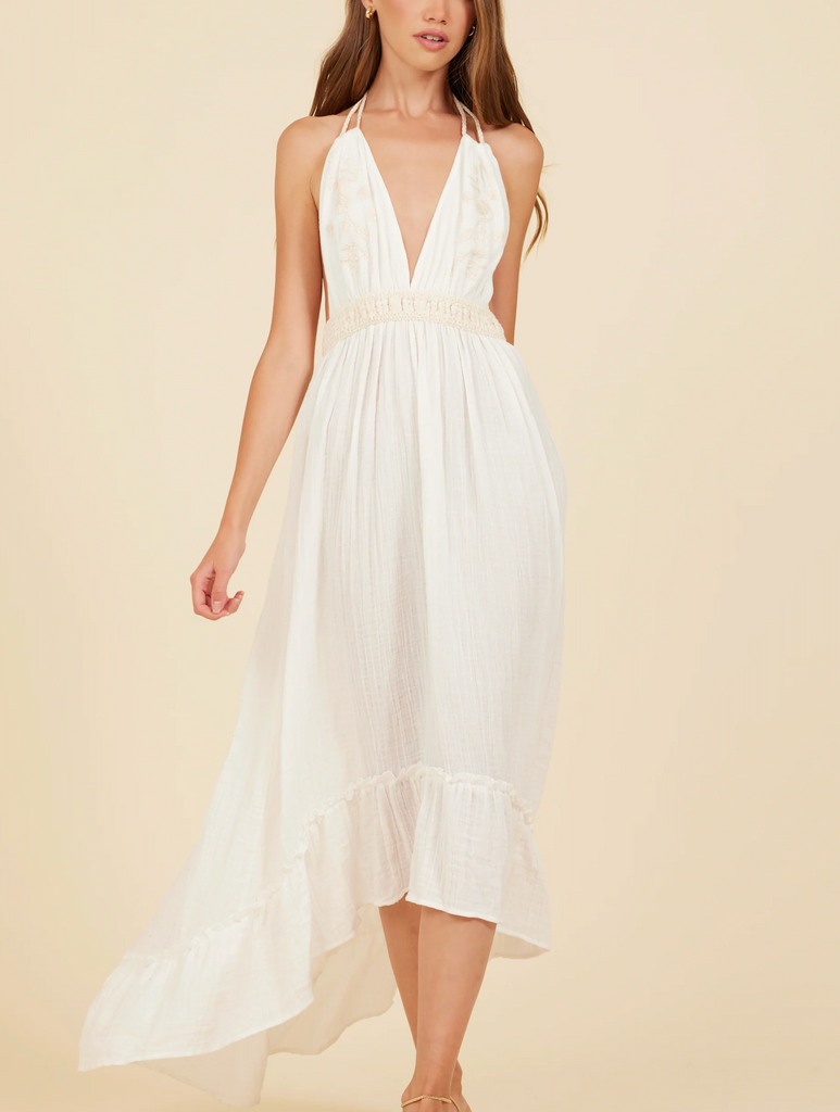 Surf Gypsy Halter Gauze Maxi Dress White Natural. This halter maxi dress features a deep v-neckline and embroidery details with an elastic waist band and tie neck for the perfect fit for any tropical occasion.