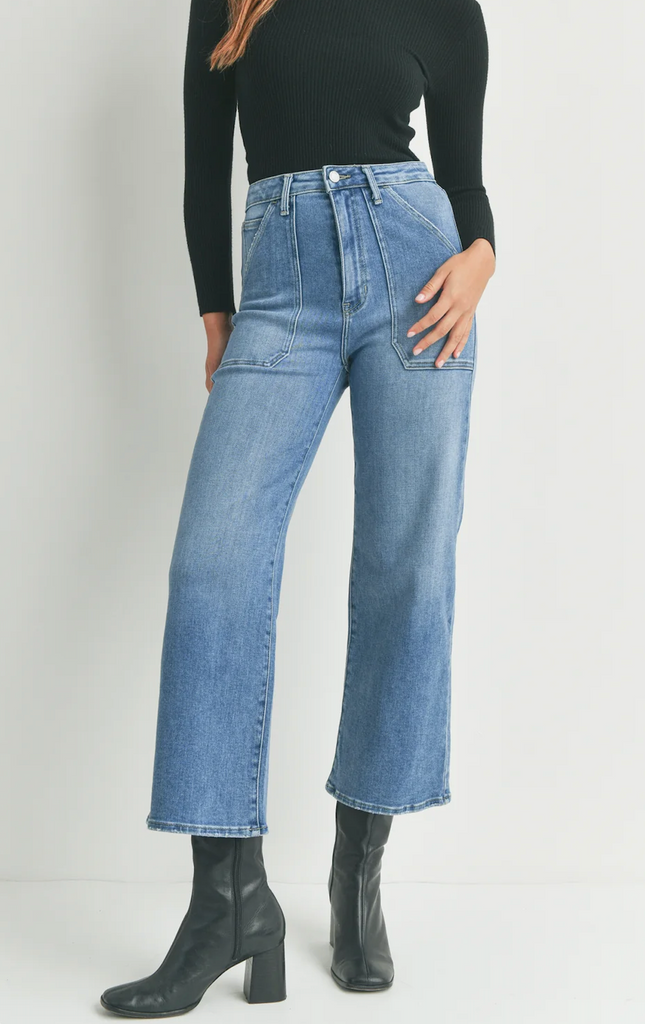 JBD Cargo Pocket Wide Leg Medium Blue Denim. Contemporary styles with 70s vibes combine to create the most comfortable, figure-flattering jeans. These wide-leg jeans feature patch pockets and a zip front closure for an all-out vintage inspired look.