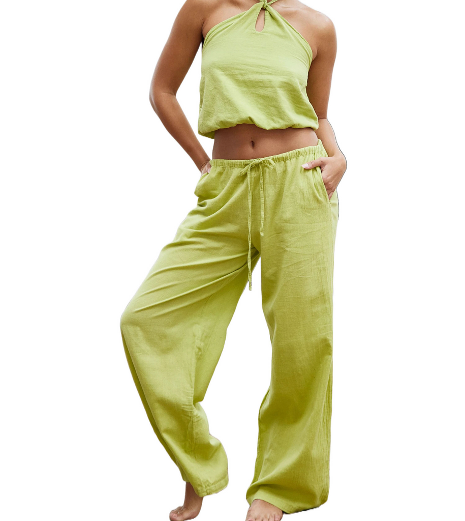 Aruba Draw String Wide Leg Pant Pistachio. Our classic piece! The versatile Chiara Pant is the perfect beach pant, made with our lightweight cotton fabric. This pant features pockets and an adjustable elastic drawstring waist that allows you to wear it either low or high on your waist.