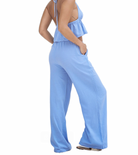 Aruba Draw String Wide Leg Pant Azure. Our classic piece! The versatile Chiara Pant is the perfect beach pant, made with our lightweight cotton fabric. This pant features pockets and an adjustable elastic drawstring waist that allows you to wear it either low or high on your waist.
