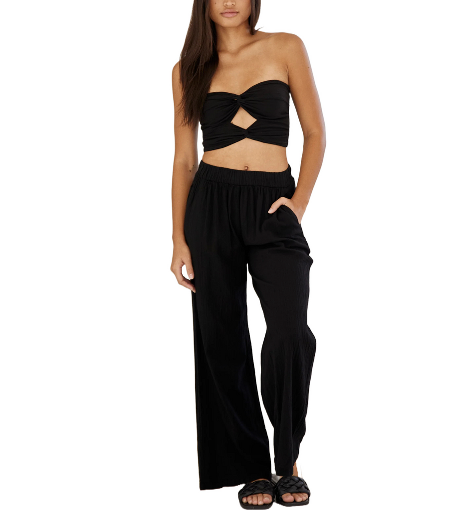 Grenada Flowy Pant Black. Designed from a high quality cotton fabric, these flowy pants feature an elastic waist and allow you to wear them styled low or high waisted for any type of look.