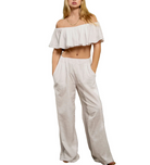 Grenada Flowy Pant White. Designed from a high quality cotton fabric, these flowy pants feature an elastic waist and allow you to wear them styled low or high waisted for any type of look.