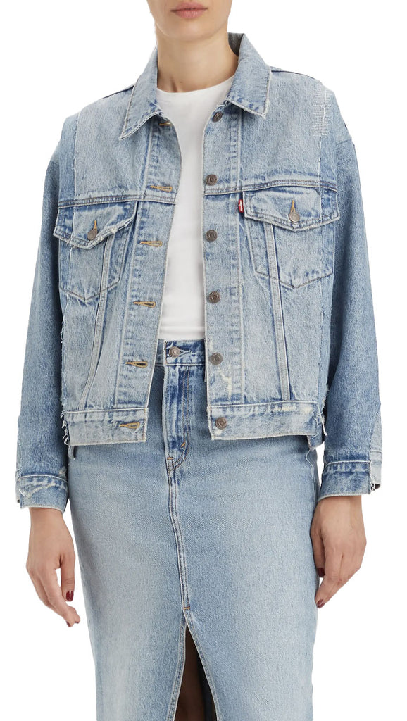 Levi 90s Trucker Jacket Washed Denim. The classic trucker jacket is weathered to old-favorite perfection with this distressed denim version cut in a boxy silhouette inspired by the iconic '90s.