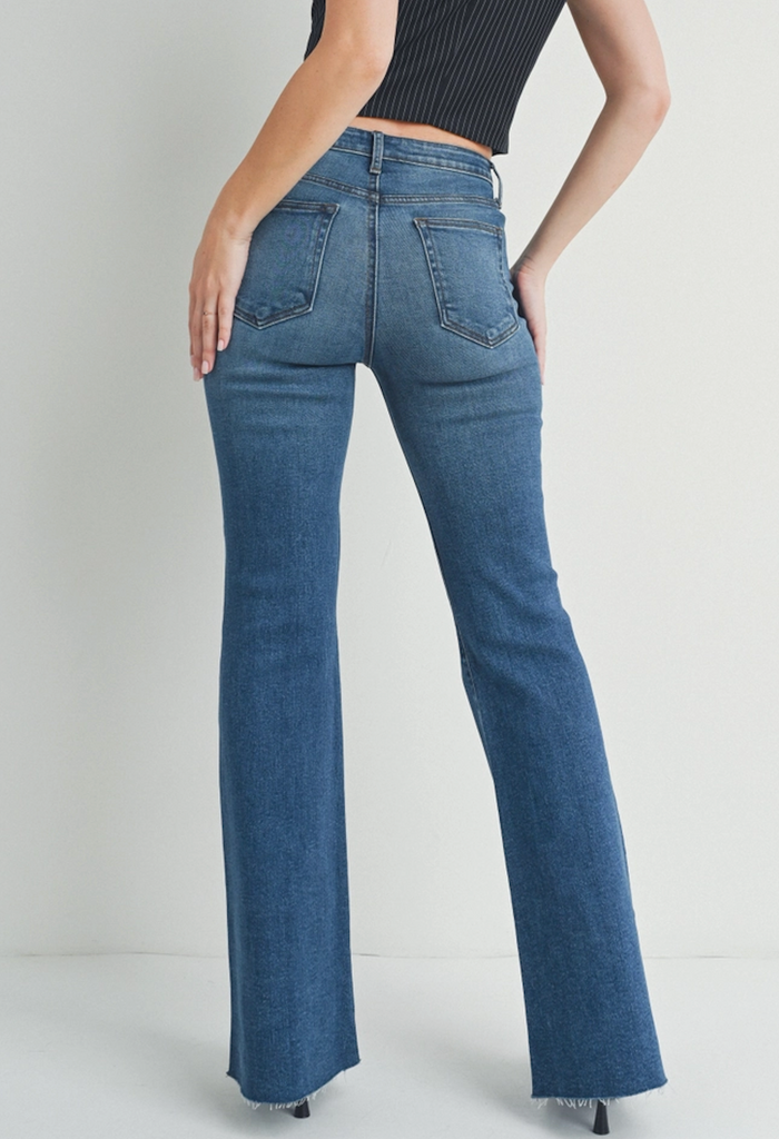 JBD Mid Rise Straight Bootcut Blue. These dark wash jeans are a must have, featuring a mid rise in a straight bootcut design, they're so easy to dress up or down for everyday wear.
