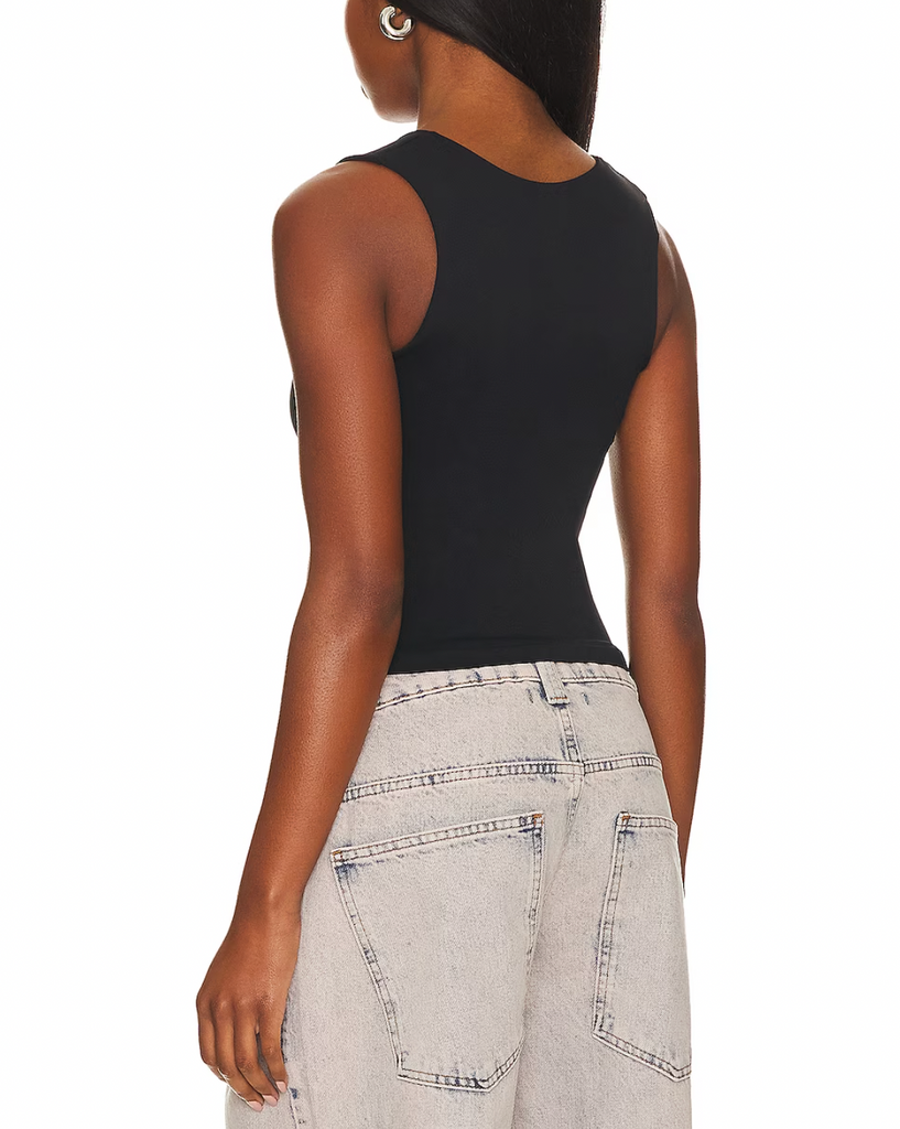 Free People Clean Lines Muscle Cami Black. A new addition to your favorite seamless collection. This sleek tank is featured in a buttery soft fabrication with a scoop-neckline and sleeveless silhouette is a must have basic.