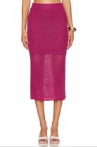 Steve Madden Liliana Skirt Misty Rose. Discover the perfect combination of style and comfort with the Liliana Skirt. This wavy crochet midi skirt features a side slit for added flair and is lined with a mini slip for a comfortable fit.