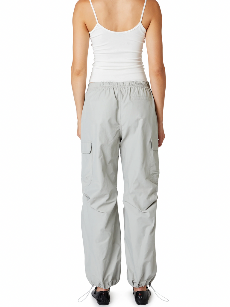 Nia Ludlow Parachute Pant Mineral. These mid-rise parachute pants feature elastic toggles at the waist and hem, with cargo pockets at the side they're the perfect cool piece to shake up your wardrobe.