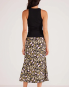 Mink Pink Louis Ruched Tank Black. The Louis Ruched Tank is the perfect styling piece that can either be used as a layer for those cooler months or by itself for when its warmer. Style with a printed bottom for a more elevated look or simple denim for a more 'off-duty' casual look.