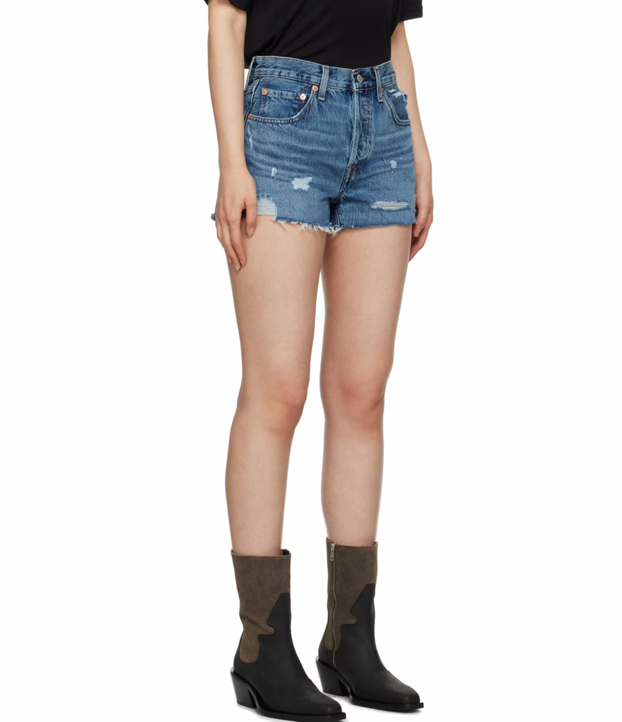 Levi 501 Medium Wash Short Blue Denim. Distressed for the best, these high-rise cutoffs are made with non-stretch denim in the iconic Levi 501 silhouette that's a must for the spring and summertime.