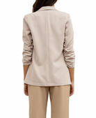 Beautiful Chaos Ruched Sleeve Blazer Oatmeal. This blazer features a shawl collar with an open front, flap pockets and ruched sleeves, the perfect basic to have in your rotation to add a touch of sophistication to any look.