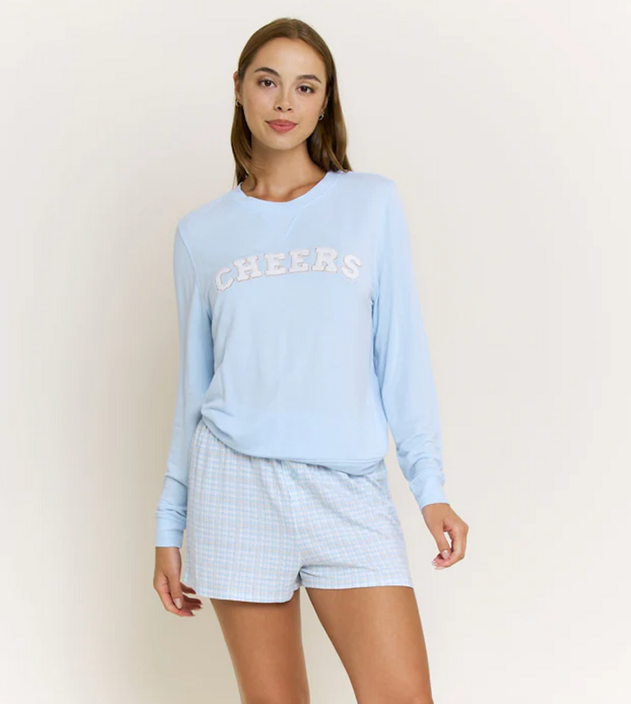 cheers lounge set, light blue pajama set women, women’s cozy lounge set, embroidered cheers top, gingham pajama shorts, cute sleepwear set, soft knit pajama set, women’s casual loungewear, comfy matching lounge set, boutique pajama set, relaxed fit sleep set, women’s lounge outfit, cute bedtime set, chic sleepwear women, cozy at home outfit