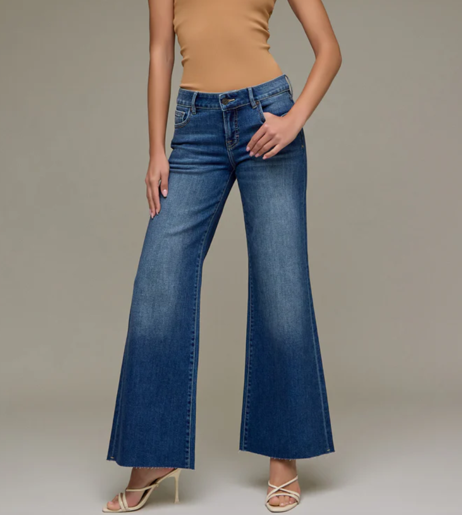 High-rise wide leg jeans with full length silhouette styled with heels