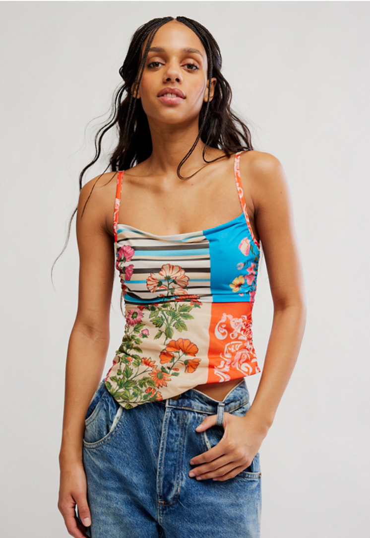 Patchwork cami top featuring floral and stripe prints with adjustable spaghetti straps and open tie-back detail.