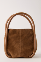Suede tote bag with rounded top handles and structured silhouette.