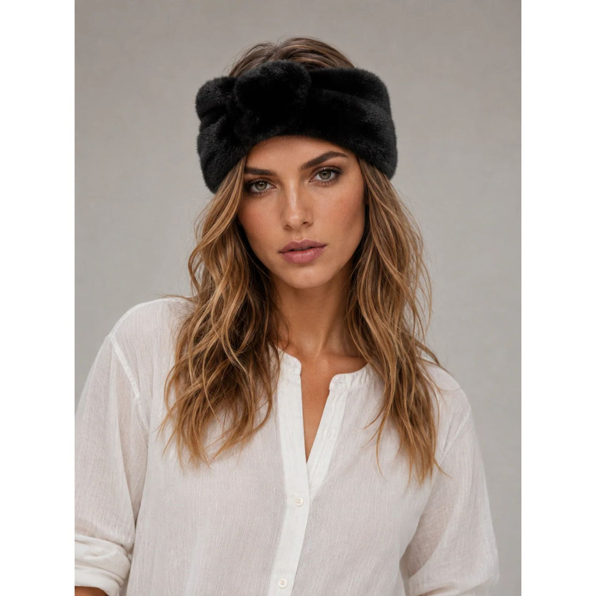Solid Faux Fur Headwrap in black featuring a plush, soft-textured finish, elegant twisted-front detail, and wide silhouette for a cozy, sophisticated winter look.