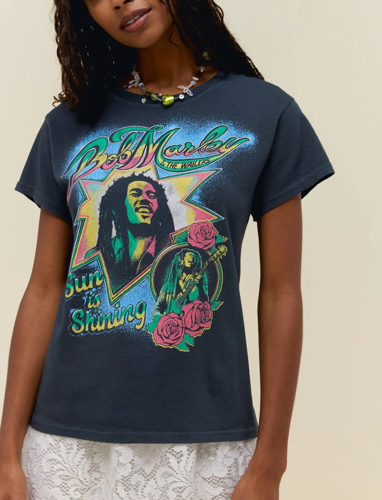Day Dreamer Bob Marley Tee Vintage Black. Inspiring generations through music that transcends borders, cultures and languages, the reggae icon’s song “Sun Is Shining” hits this tour tee featuring portraits of the guy who told us every little thing is gonna be alright.
