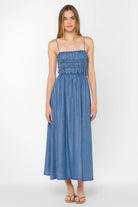 Maxi dress with smocked bodice, thin straps, and flowy skirt