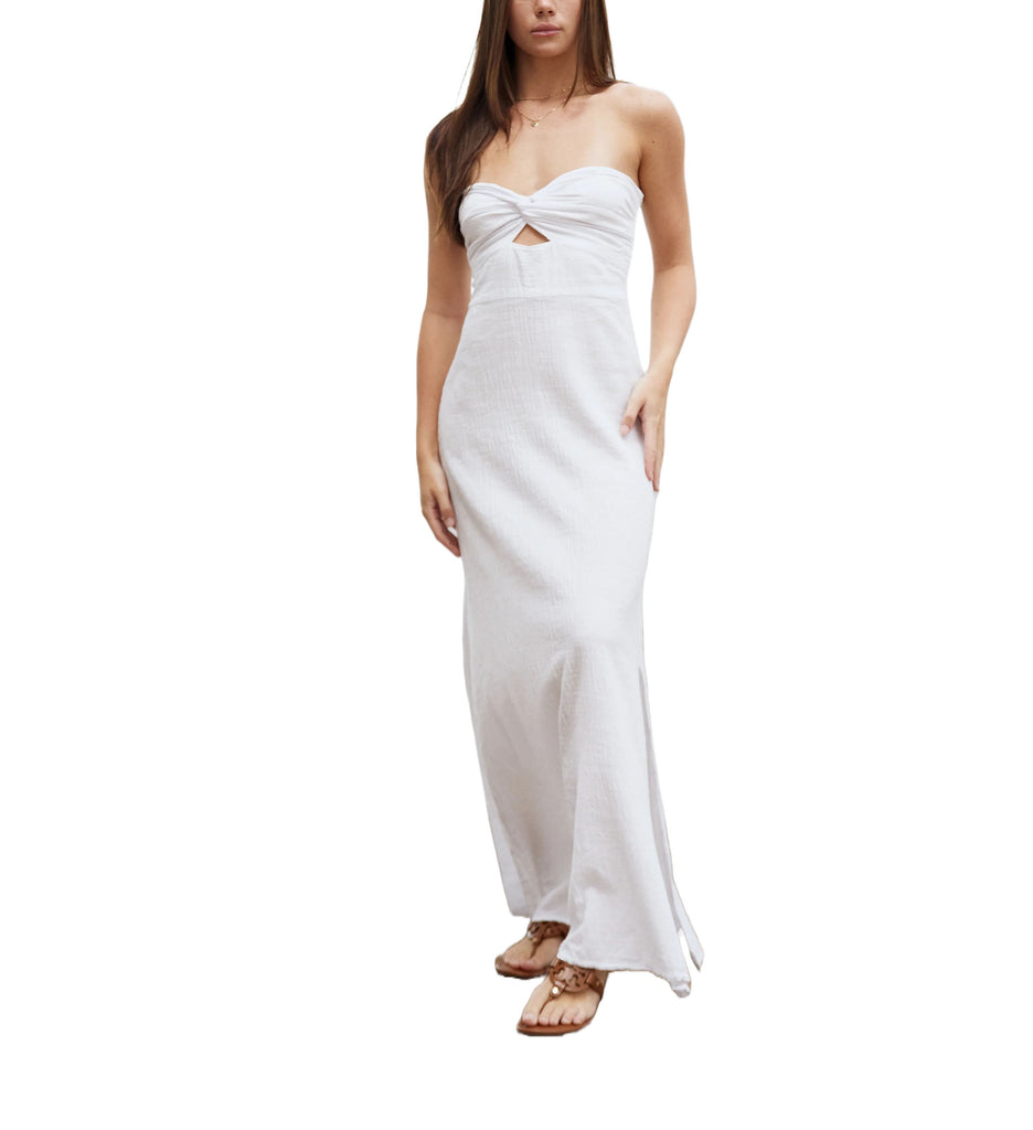 Catalina Strapless Maxi Dress White. This maxi dress is s a strapless piece featuring a twist front detail, flowy ankle grazing hem and split along the left side. Dress it up with heels or pair with flats for an effortless beachy look.