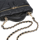 Urban Expressions Snow Crossbody Bag in Black, detail of top handle and chain strap