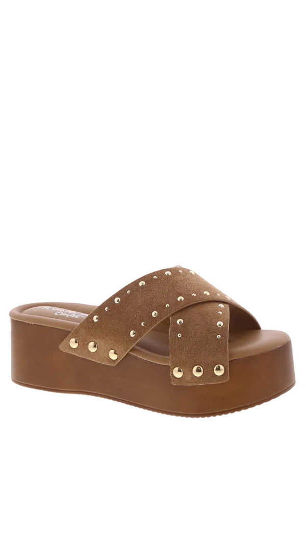 Platform slide sandal with crisscross straps and stud detailing designed as a slip on shoe