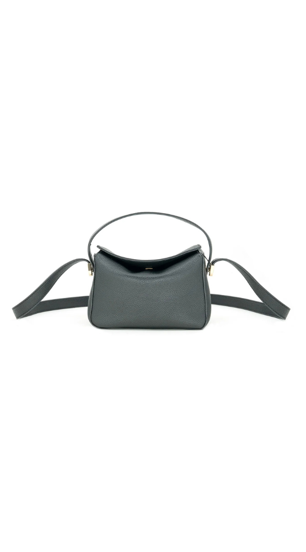 Black curved dental tool on a white background