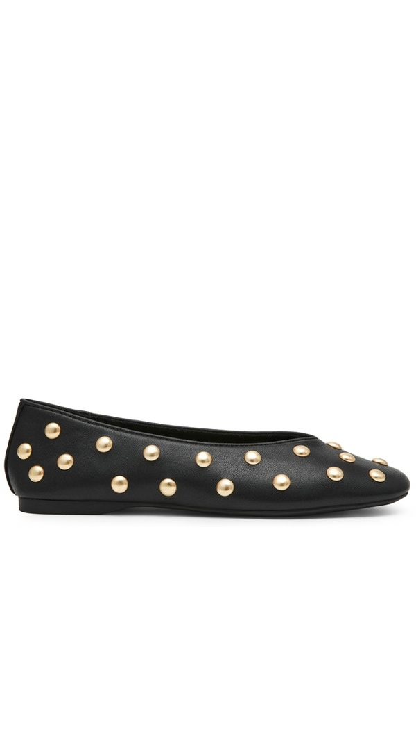 A black leather ballet flat shoe with metallic gold studs arranged in a diagonal pattern across the upper, shown in a side profile on a white background.