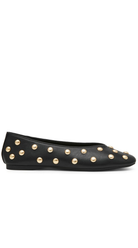 A black leather ballet flat shoe with metallic gold studs arranged in a diagonal pattern across the upper, shown in a side profile on a white background.