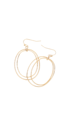 Mixed metal drop earrings with intertwined gold and silver oval hoops.